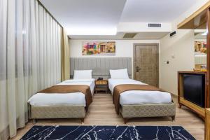 Postel nebo postele na pokoji v ubytování Dem İstanbul Airport Hotel