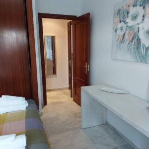 Ένα ή περισσότερα κρεβάτια σε δωμάτιο στο IJD apartaments 6 PARKING GRATIS Y PISCINA