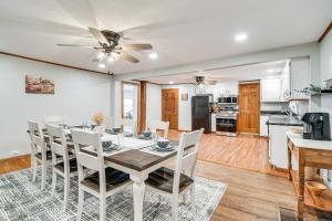 a kitchen and dining room with a table and chairs at Auburn Finger Lakes Farmhouse with Open Views! in Auburn