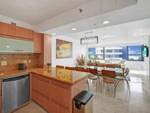 a kitchen and dining room with a table and chairs at Beach Resort condo 921 in Miami Beach