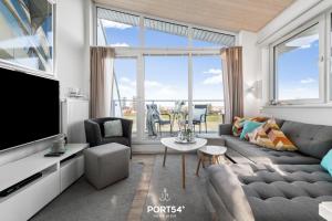 Et tv og/eller underholdning på Ferienhaus Ankerplatz Marina Wendtorf