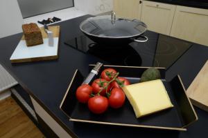 a plate of tomatoes and cheese on a counter at Albatros in Flensburg