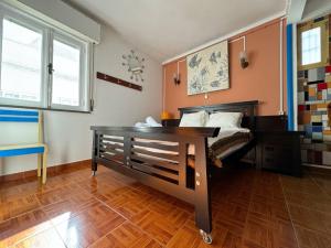 a bedroom with a bed and a desk in it at Lagos Central Hostel in Lagos