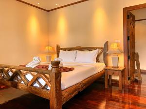 Postel nebo postele na pokoji v ubytování Baan Hin Sai Resort & Spa