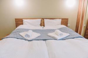 Кровать или кровати в номере MaRKoS flat in Bakuriani Inn +31 фотография
