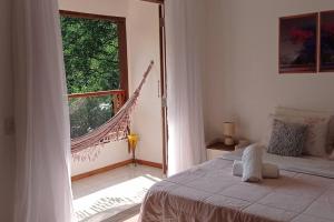 Ένα ή περισσότερα κρεβάτια σε δωμάτιο στο Casa com Quintal Ideal para o Pet e Churrasqueira