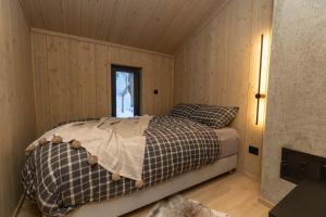 En eller flere senger på et rom på High standard cabin in a quiet area in the bossom of nature near Flå