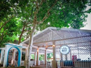 a white tent with a sign that reads take a nest at Baan Hin Sai Resort & Spa in Chaweng Noi Beach