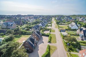 an aerial view of a residential neighborhood with houses at Feriendomizil App 7 in Wenningstedt