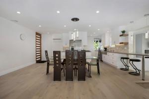 a kitchen and dining room with a table and chairs at Venice Villa with pool, music studio in Los Angeles