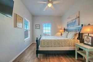 a bedroom with a bed and a ceiling fan at Fishtastic by AvantStay Retreat w Pool Access in Padre Island