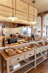 a bakery with many different types of pastries on display at Casa Tosca in Fátima
