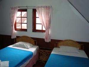 Un pat sau paturi într-o cameră la A&B Hotel
