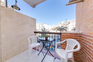 A balcony or terrace at Apartment with pool near beach, Playa del Cura