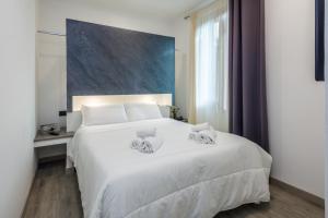 Postel nebo postele na pokoji v ubytování Crossroad Hotel