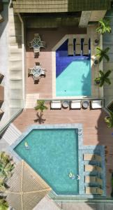 an overhead view of a swimming pool in a resort at San Marino Suite Hotel in Maceió
