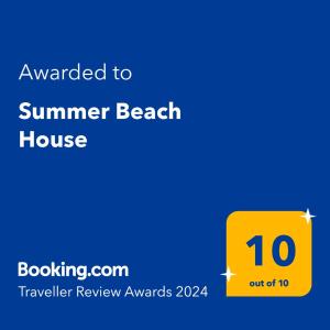 a yellow sign with the text awarded to summer beach house at Summer Beach House in Summerland