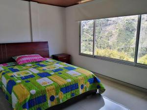 Voodi või voodid majutusasutuse FINCA LA VEGA toas