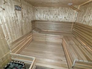 an empty sauna with wooden floors and ceilings at Švihák lázeňský in Velké Losiny