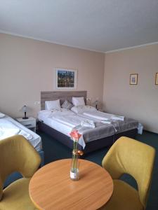 Postel nebo postele na pokoji v ubytování Hotel Unicornis