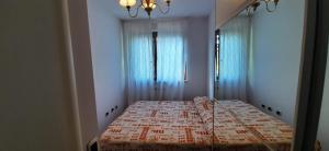 a bedroom with a large bed in a room at Casa Mia Sirolo in Sirolo