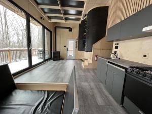 a kitchen with a sink and a counter top at Cabin Zoobox 63 in Eastman