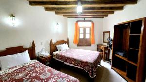 Postel nebo postele na pokoji v ubytování Hotel Plaza Baratillo