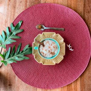 a red plate with a bowl of food and a spoon at Espaço Vento Solar in São Roque +16 photos