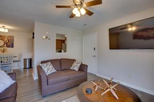 a living room with a couch and a table at Greensboro Vacation Rental Condo Near Downtown in Greensboro