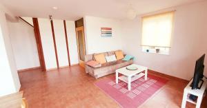 a living room with a couch and a table at Bocasa Bodman in Bodman-Ludwigshafen