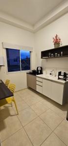 a kitchen with a sink and a counter top at Flat na Av. Fernando Côrrea in Cuiabá