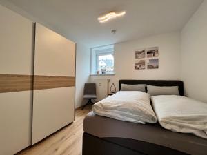 Postel nebo postele na pokoji v ubytování SEEglück