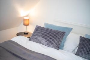 Ein Bett oder Betten in einem Zimmer der Unterkunft Hingst, App. 3 Nettes Neest