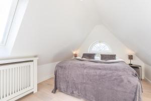 Ein Bett oder Betten in einem Zimmer der Unterkunft Hingst, App. 3 Nettes Neest
