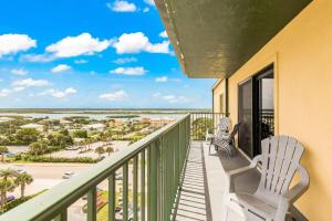 a balcony with two chairs and a view of the ocean at Ocean Views from Your Private Balcony! Sunglow Resort 907 by Brightwild in Daytona Beach Shores +25 photos
