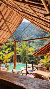 a view of a resort with a swimming pool at Cabaña la roca de minca sierra nevada in Santa Marta