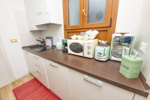 A kitchen or kitchenette at Isa Sweet Home