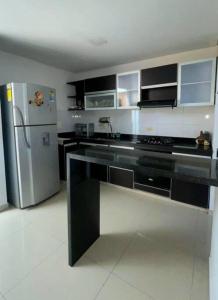 Una cocina o zona de cocina en VP Casa Condominio con Aire Acon