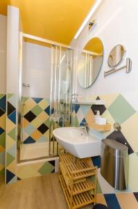 a bathroom with a sink and a shower at Apartments Urban in Split