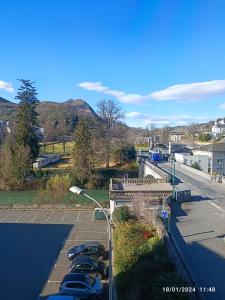 a group of cars parked in a parking lot at Chambre chez Marie et Didier 1 minute à pied du sanctuaire de Lourdes in Lourdes +19 photos