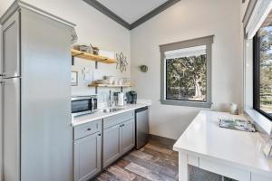 a kitchen with white cabinets and a white counter top at 7A Ranch in Wimberley