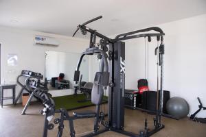 a room with a gym with a treadmill at Luxurious 2 Bedroom The Edge Labone in Accra