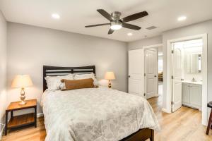 a bedroom with a bed and a ceiling fan at Rental with Pool Access about 8 Mi to Disneyland in La Palma