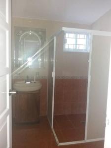 a bathroom with a shower and a sink at Preciosa casa totalmente amueblada y equipada. in Veracruz