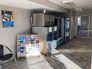 a room with a refrigerator and other appliances at Motel 6-Reno, NV - Livestock Events Center in Reno