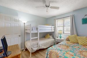 a bedroom with a bed and a bunk bed at Spencer's Watch in Avon