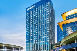 a tall building with a sign on the side of it at Le Meridien Putrajaya in Putrajaya