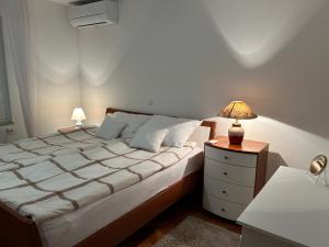 Posteľ alebo postele v izbe v ubytovaní Apartment Tina