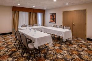 a meeting room with four tables and chairs in it at Hampton Inn Elkhart in Elkhart