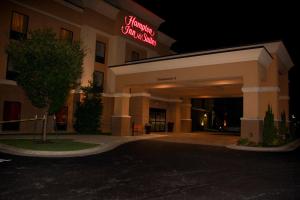 a hotel with a sign on the front of it at Hampton Inn & Suites Radcliff/Fort Knox in Radcliff